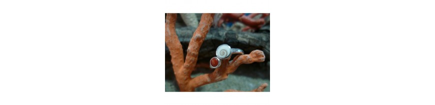 Rings with the Eye of Saint Lucia and red coral